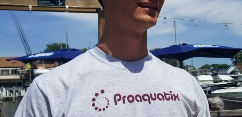man with grey proaquatix t-shirt and sunglasses