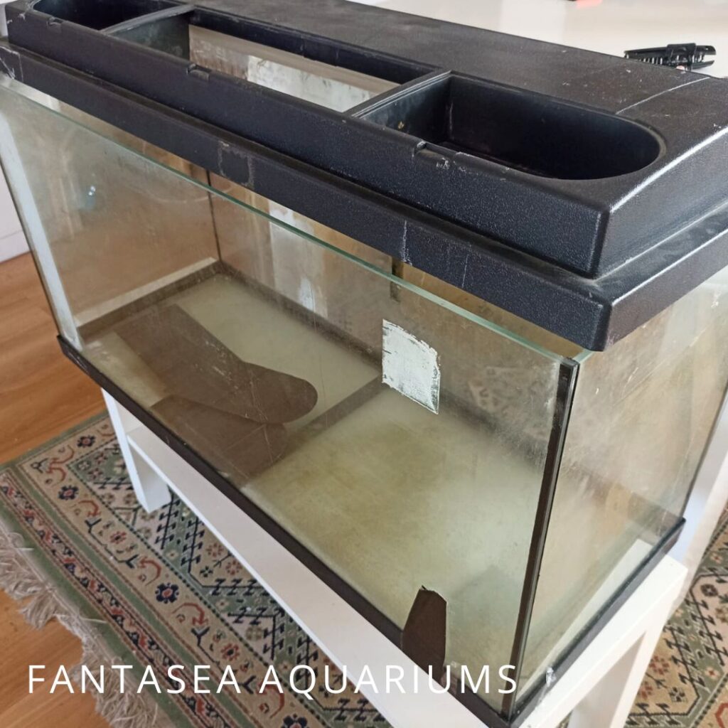 Empty fish tank in rough condition